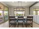 Bright dining area with modern chandelier and natural light, adjacent to the kitchen and living areas at 27395 W Wahalla Ln, Buckeye, AZ 85396