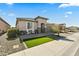 Charming single-story home with a well-manicured front yard and a two-car garage at 27395 W Wahalla Ln, Buckeye, AZ 85396