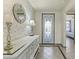 Beautiful foyer featuring a decorative mirror and a stylish console table at 27395 W Wahalla Ln, Buckeye, AZ 85396