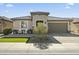 Charming home with a well-maintained front yard and a two-car garage at 27395 W Wahalla Ln, Buckeye, AZ 85396