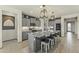 Modern kitchen with granite countertops, stainless steel appliances, and a large island at 27395 W Wahalla Ln, Buckeye, AZ 85396