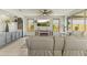Bright living room features a fireplace, neutral finishes, and large windows at 27395 W Wahalla Ln, Buckeye, AZ 85396