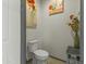 A powder room with floral art and accents at 27395 W Wahalla Ln, Buckeye, AZ 85396