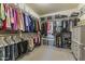 Spacious walk-in closet with custom shelving and organized storage solutions for clothes at 27395 W Wahalla Ln, Buckeye, AZ 85396