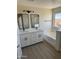 Modern bathroom with double vanity, soaking tub, and large mirror at 28756 N Desert Hills Dr, San Tan Valley, AZ 85143