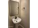 Modern bathroom with pedestal sink and black accents at 28756 N Desert Hills Dr, San Tan Valley, AZ 85143