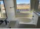 Bathroom featuring a garden tub and a view at 28756 N Desert Hills Dr, San Tan Valley, AZ 85143