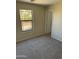 Bedroom with neutral carpeting and large window at 28756 N Desert Hills Dr, San Tan Valley, AZ 85143