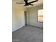 Bedroom with ceiling fan, closet, and neutral carpeting at 28756 N Desert Hills Dr, San Tan Valley, AZ 85143