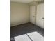 Spacious bedroom with gray carpeting and double door closets at 28756 N Desert Hills Dr, San Tan Valley, AZ 85143