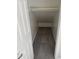 Small closet with gray carpeting and shelving at 28756 N Desert Hills Dr, San Tan Valley, AZ 85143