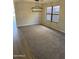 Bright dining room with chandelier, hardwood floors, and large windows at 28756 N Desert Hills Dr, San Tan Valley, AZ 85143