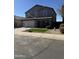 Two-story house with gray exterior, white garage door, and landscaped yard at 28756 N Desert Hills Dr, San Tan Valley, AZ 85143