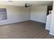 Spacious Gathering room with hardwood floors and ceiling fan at 28756 N Desert Hills Dr, San Tan Valley, AZ 85143