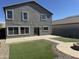 Two-story house with gray exterior and landscaped yard at 28756 N Desert Hills Dr, San Tan Valley, AZ 85143