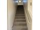 Carpeted staircase leading to the upper level of the home at 28756 N Desert Hills Dr, San Tan Valley, AZ 85143