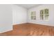 Bright bedroom featuring hardwood floors and large windows at 2989 N 44Th St # 1004, Phoenix, AZ 85018