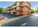Exterior view of a modern building with attached garages and landscaping at 2989 N 44Th St # 1004, Phoenix, AZ 85018