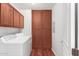 Laundry room with washer, dryer, and ample cabinet storage at 2989 N 44Th St # 1004, Phoenix, AZ 85018