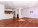 Open living room and kitchen with hardwood floors at 2989 N 44Th St # 1004, Phoenix, AZ 85018