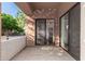 Private patio with sliding glass doors and brick columns at 2989 N 44Th St # 1004, Phoenix, AZ 85018