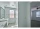 Bright bathroom with a stand up glass shower and modern white countertops at 32034 N 125Th Ave, Peoria, AZ 85383