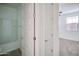 Bright bathroom and bedroom with modern fixtures and neutral color palette at 32034 N 125Th Ave, Peoria, AZ 85383