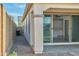 Side exterior of the home features a covered patio and a block wall for privacy at 32034 N 125Th Ave, Peoria, AZ 85383