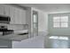 Modern kitchen featuring white cabinets, stainless steel appliances, and a spacious island at 32034 N 125Th Ave, Peoria, AZ 85383
