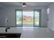 Bright and airy living space with sliding glass doors leading to a well-kept backyard at 32034 N 125Th Ave, Peoria, AZ 85383