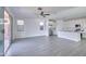 Open concept living area with tile flooring, lots of natural light, and direct access to the kitchen at 32034 N 125Th Ave, Peoria, AZ 85383