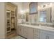 Double vanity bathroom with large mirror and linen closet at 3330 S Sycamore Village Dr, Gold Canyon, AZ 85118