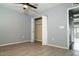 Bedroom with wood-look flooring and double door closet at 3331 W Del Monico Ln, Phoenix, AZ 85051