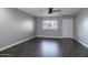 Bright living room with wood-look floors and neutral wall colors at 3331 W Del Monico Ln, Phoenix, AZ 85051