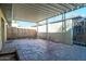 Covered patio and spacious backyard with brick flooring at 3331 W Del Monico Ln, Phoenix, AZ 85051