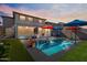 Inviting backyard oasis with a sparkling pool and ample patio space at 38100 W Santa Clara Ave, Maricopa, AZ 85138