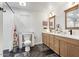 Bathroom with double vanity and herringbone floor at 38100 W Santa Clara Ave, Maricopa, AZ 85138