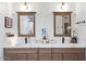 Bathroom with double vanity and modern lighting at 38100 W Santa Clara Ave, Maricopa, AZ 85138