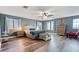 Large bedroom with ceiling fan and wood-look floors at 38100 W Santa Clara Ave, Maricopa, AZ 85138