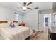 Bright bedroom with window and wood flooring at 38100 W Santa Clara Ave, Maricopa, AZ 85138