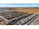 Aerial view of a large residential community with many houses and green spaces at 38100 W Santa Clara Ave, Maricopa, AZ 85138