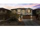 Two-story home with a welcoming front porch and landscaping at 38100 W Santa Clara Ave, Maricopa, AZ 85138