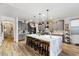 Spacious kitchen with an expansive island and hardwood floors at 38100 W Santa Clara Ave, Maricopa, AZ 85138