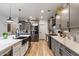 Modern kitchen with gray cabinets, white countertops and a farmhouse sink at 38100 W Santa Clara Ave, Maricopa, AZ 85138
