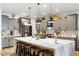 Modern kitchen with gray cabinets and white quartz countertops at 38100 W Santa Clara Ave, Maricopa, AZ 85138