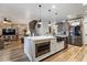 Open concept kitchen features a large island and stainless steel appliances at 38100 W Santa Clara Ave, Maricopa, AZ 85138