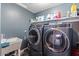 Laundry room with washer, dryer, and additional storage at 38100 W Santa Clara Ave, Maricopa, AZ 85138