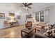 Bright and airy living room with a farmhouse style and hardwood floors at 38100 W Santa Clara Ave, Maricopa, AZ 85138