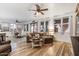 Open living room with L-shaped sectional sofa and hardwood floors at 38100 W Santa Clara Ave, Maricopa, AZ 85138