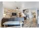 Cozy living room with a rustic feature wall and hardwood floors at 38100 W Santa Clara Ave, Maricopa, AZ 85138